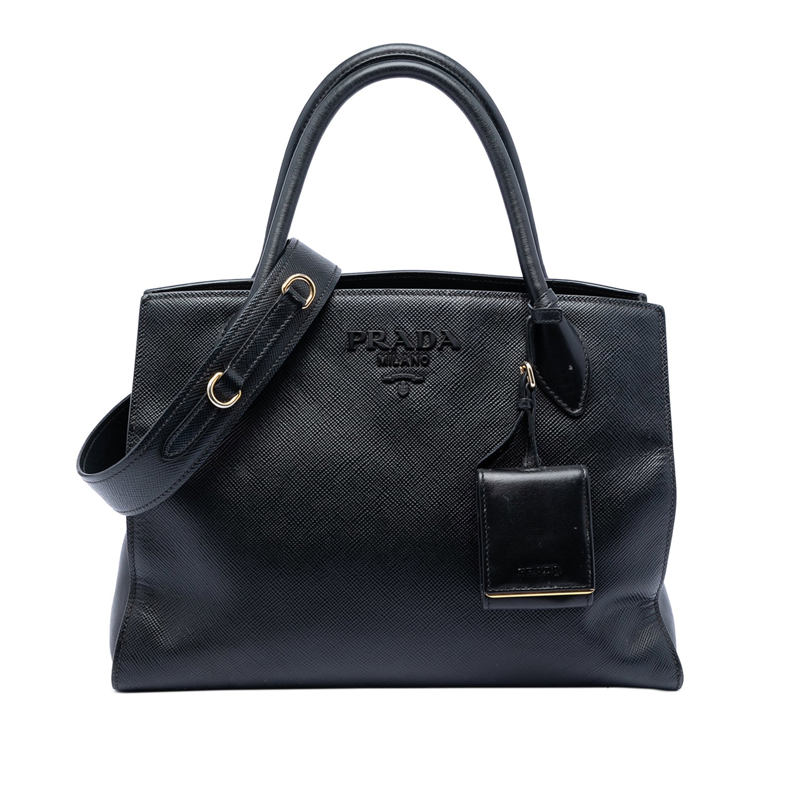 Prada Saffiano Cuir Monochrome Black Leather Satchel with Strap: Prada Saffiano Cuir Monochrome Black Leather Satchel with Strap This Prada Saffiano Cuir Monochrome Satchel features a saffiano leather body in black, rolled leather handles, a detachable flat leather