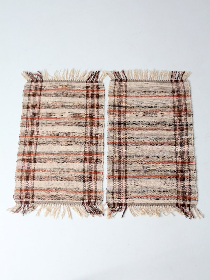 Charming Vintage Plaid Accent Rugs Pair Hand-Loomed Cotton: Charming Vintage Plaid Accent Rugs Pair Hand-Loomed Cotton Enhance your decor with this charming pair of vintage American rag rugs. Hand-loomed from cotton, these accent rugs showcase a warm plaid pat