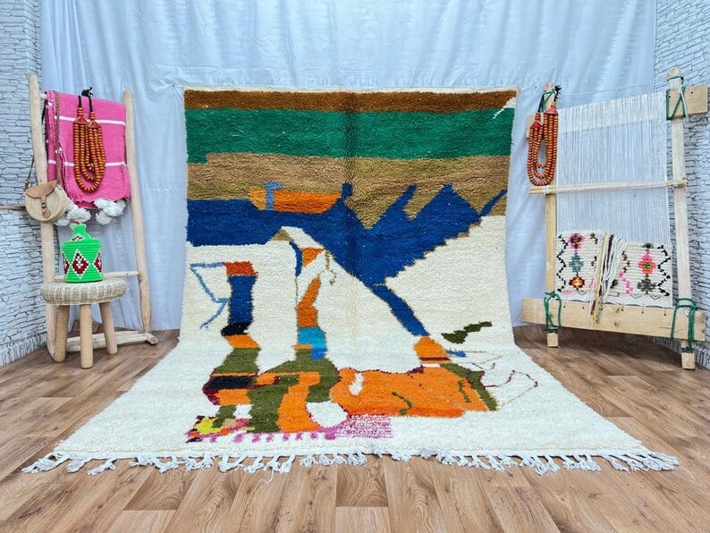 Vibrant Handwoven Moroccan Rug 100% Sheep Wool: Vibrant Handwoven Moroccan Rug 100% Sheep Wool Experience the beauty of this stunning colorful rug, handwoven in the Atlas Mountains by skilled local Berber women weavers. Crafted using traditional to