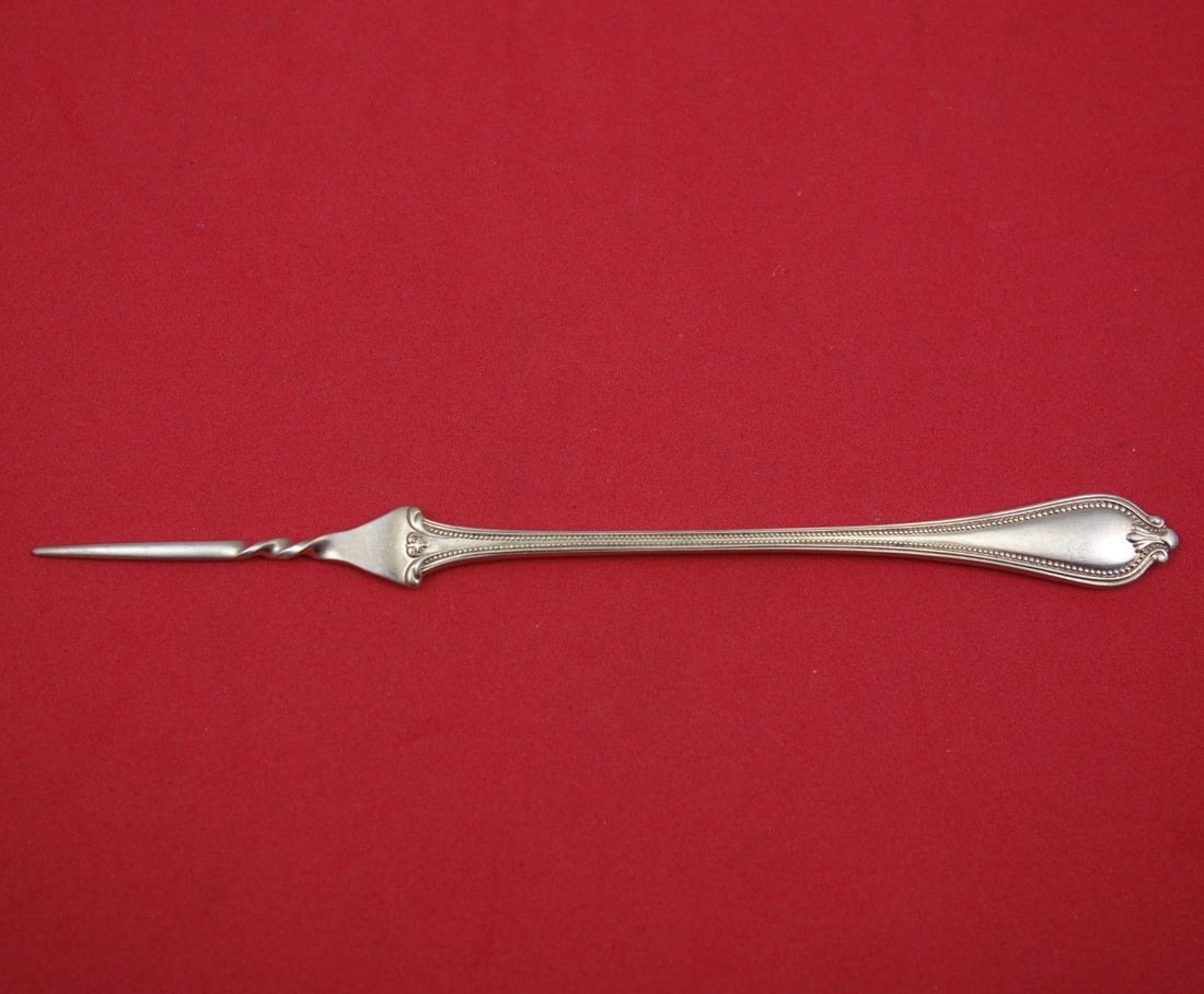 Towle Old Newbury Sterling Silver Twisted Butter Pick 5 3/4": Towle Old Newbury Sterling Silver Twisted Butter Pick 5 3/4" This exquisite butter pick is crafted in sterling silver and features the elegant Old Newbury pattern by Towle. Measuring 5 3/4 inches, thi