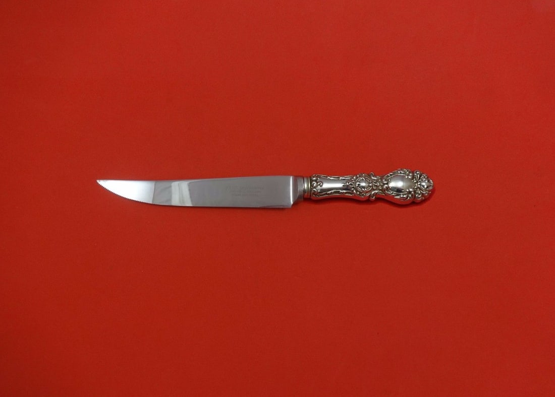 Wallace Lucerne Sterling Silver Custom Steak Knife 8.5": Wallace Lucerne Sterling Silver Custom Steak Knife 8.5" Introducing the exquisite Lucerne steak knife by Wallace, a fine addition to any dining experience. This custom-made knife features a hollow han