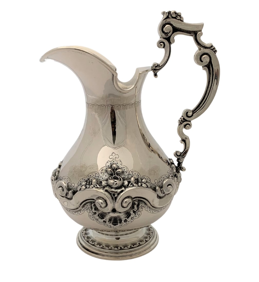 Handmade 925 Sterling Silver Floral Pitcher 10 Inches: Handmade 925 Sterling Silver Floral Pitcher 10 Inches This exquisite pitcher is crafted from fine Portuguese 925 sterling silver, showcasing intricate handmade floral ornate designs. The sleek and shi