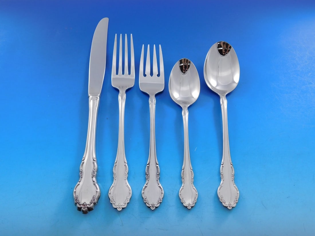 77 Piece Tennyson Stainless Flatware Service With Caddy Traditional Floral Pattern: 77 Piece Tennyson Stainless Flatware Service With Caddy Traditional Floral Pattern The Tennyson by Oneida flatware set features a traditional floral handle pattern in glossy stainless steel. This comp