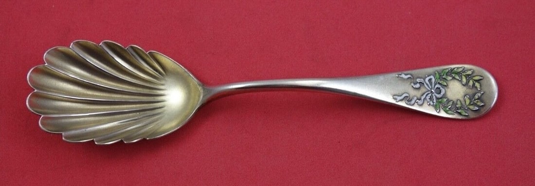 Shiebler Napoleon Sterling Silver Vermeil Sugar Spoon 6 1/8": Shiebler Napoleon Sterling Silver Vermeil Sugar Spoon 6 1/8" This exquisite sugar spoon is crafted from sterling silver and features a stunning vermeil enameled shell design, embodying the elegant Nap
