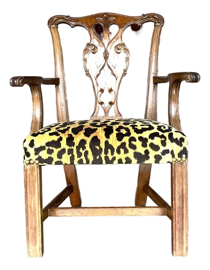 Petite Chippendale Armchair with Leopard Velvet and Carved Mahogany Details: Petite Chippendale Armchair with Leopard Velvet and Carved Mahogany Details This vintage Chippendale armchair features a solid wood frame, likely mahogany or cherry, with finely carved details and a p