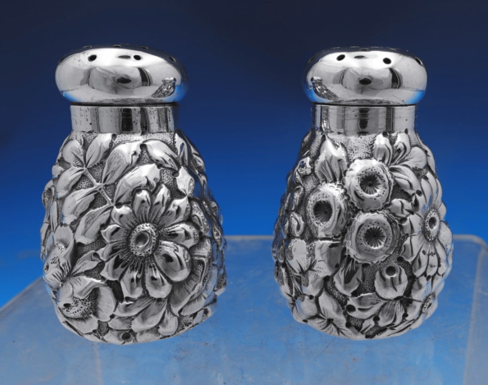 Shiebler Flora Sterling Silver Salt Pepper Shakers 2pc: Shiebler Flora Sterling Silver Salt Pepper Shakers 2pc This is a two-piece salt and pepper shaker set in the Flora pattern by Shiebler, crafted from sterling silver (.925) and made in the United State