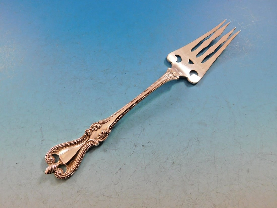 Sterling Silver Pierced Fish Fork 6 3/8 Inch Old Colonial Pattern: Sterling Silver Pierced Fish Fork 6 3/8 Inch Old Colonial Pattern This is a pierced fish fork crafted in sterling silver, featuring the Old Colonial pattern by Towle. Measuring 6 3/8 inches in length,