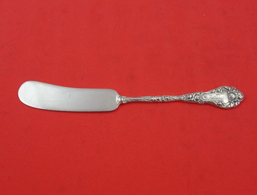 Durgin Marechal Niel Sterling Silver Butter Spreader 5 1/4": Durgin Marechal Niel Sterling Silver Butter Spreader 5 1/4" This exquisite butter spreader features a flat handle design in the elegant Marechal Niel pattern by Durgin. Crafted from high-quality sterl