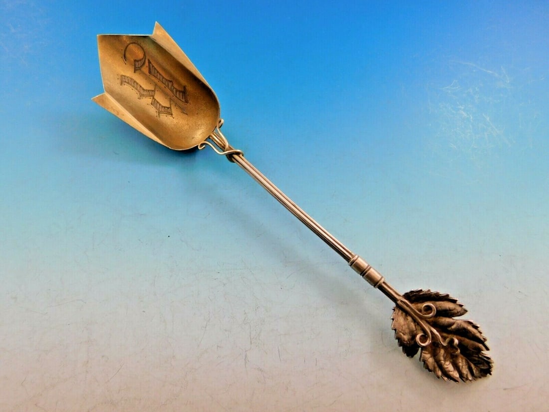 Wood & Hughes Art Silver Sterling Silver Cheese Scoop 7.75" Leaf Design: Wood & Hughes Art Silver Sterling Silver Cheese Scoop 7.75" Leaf Design This exquisite sterling silver cheese scoop, crafted by Wood and Hughes in the Art Silver pattern circa 1860-1883, showcases a s