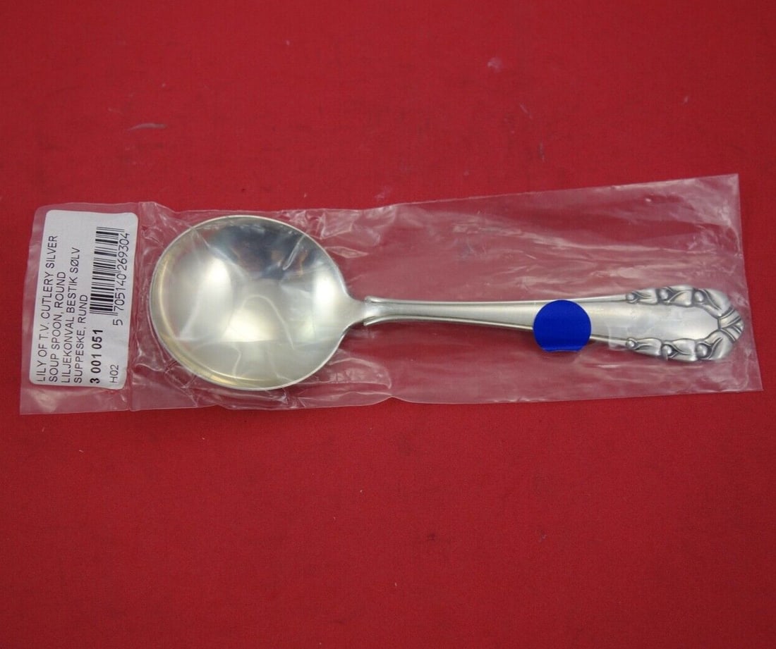 Georg Jensen Sterling Silver Cream Soup Spoon Lily of the Valley 6.5": Georg Jensen Sterling Silver Cream Soup Spoon Lily of the Valley 6.5" This exquisite cream soup spoon features the iconic "Lily of the Valley" pattern by Georg Jensen, crafted from high-quality sterli