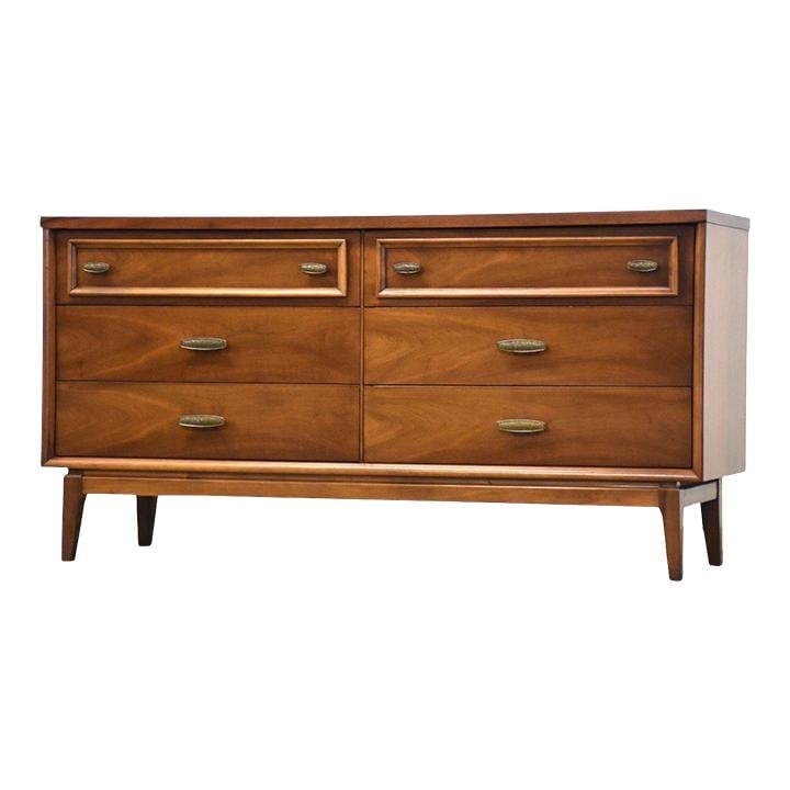 Mid Century Modern Walnut Dresser with Bronze Hardware 60": Mid Century Modern Walnut Dresser with Bronze Hardware 60" This elegant mid-century modern dresser features a rich walnut finish and six spacious drawers, providing ample storage while enhancing your 