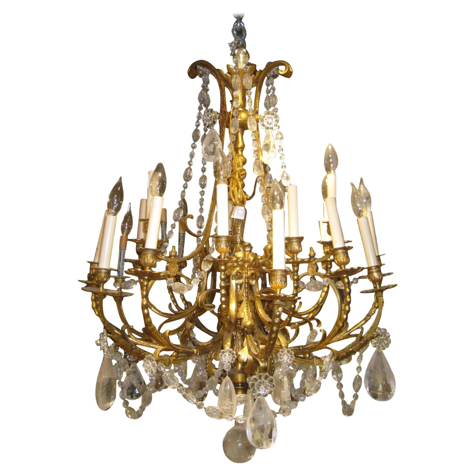Late 19th Century French Bronze 16-Light Chandelier with Rock Crystal Pendants: Late 19th Century French Bronze 16-Light Chandelier with Rock Crystal Pendants This large French 19th century chandelier features 16 lights and is crafted in the Louis XV/XVI style. Made of gilt bronz