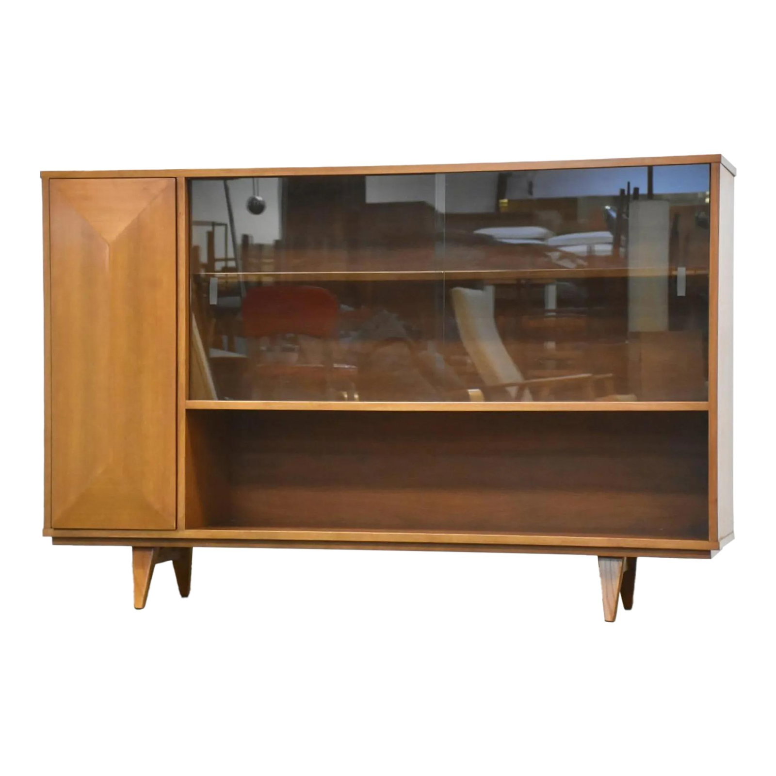 1960s Mid Century Modern Walnut Bookcase with Glass Doors: 1960s Mid Century Modern Walnut Bookcase with Glass Doors This stunning mid-century modern walnut bookcase features elegant glass sliding doors and a unique push-to-open diamond front door. Crafted wi