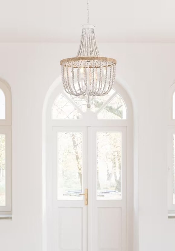 LIVING DISTRICT Antique White Wood Bead Chandelier 4 Light: LIVING DISTRICT Antique White Wood Bead Chandelier 4 Light This farmhouse-inspired chandelier features an antique white finish and a round frame adorned with wood beads and hand rope knots for a chic,