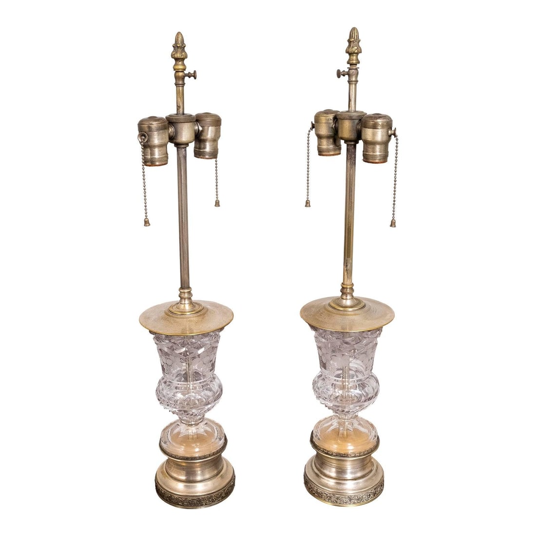 Vintage 1950s Regency Cut Glass Silver Plate Table Lamps Pair: Vintage 1950s Regency Cut Glass Silver Plate Table Lamps Pair This elegant pair of Regency style table lamps showcases high-quality construction and features solid brass hardware. The intentional dist