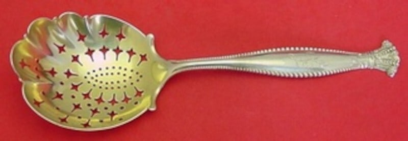 Shiebler Sandringham Sterling Silver Gold Washed Serving Spoon 9 1/8": Shiebler Sandringham Sterling Silver Gold Washed Serving Spoon 9 1/8" Introducing the exquisite Sandringham serving spoon by Shiebler, crafted from high-quality sterling silver with a beautiful gold w