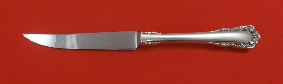 Lunt Carillon Sterling Silver Custom Steak Knife 8.5 Inch Serrated Blade: Lunt Carillon Sterling Silver Custom Steak Knife 8.5 Inch Serrated Blade Discover the exquisite Carillon steak knife by Lunt, crafted from premium sterling silver with a hollow handle and a stainless 