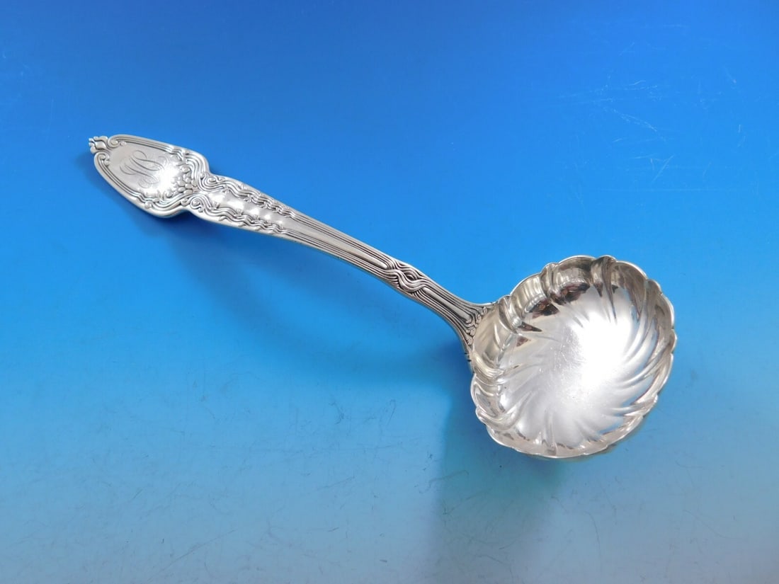 Tiffany Co Broomcorn Sterling Silver Gravy Ladle with Swirled Ruffled Bowl: Tiffany Co Broomcorn Sterling Silver Gravy Ladle with Swirled Ruffled Bowl Sterling silver gravy ladle in the Broom Corn pattern by Tiffany & Co., featuring a swirled ruffled bowl and a decorative han