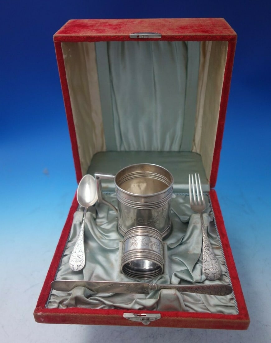 Knowles Poppy Sterling Silver Child's 5pc Set in Fitted Box: Knowles Poppy Sterling Silver Child's 5pc Set in Fitted Box This charming five-piece child's set, crafted by Knowles, features a delightful Poppy motif and is made of sterling silver with a bright-cut