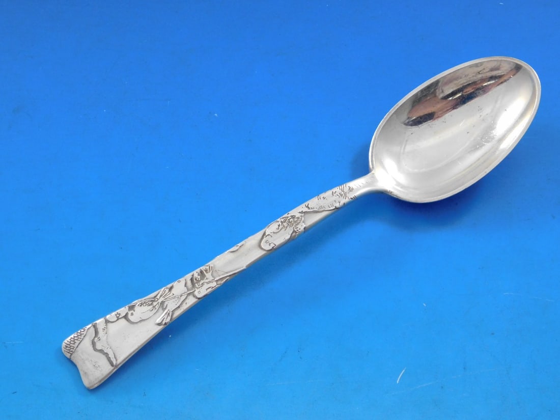 Tiffany Sterling Silver 6" Teaspoon Lap Over Edge Bird Design: Tiffany Sterling Silver 6" Teaspoon Lap Over Edge Bird Design This exquisite Tiffany & Co. sterling silver teaspoon features the elegant 'Lap Over Edge' pattern and showcases a delicate bird on a bran