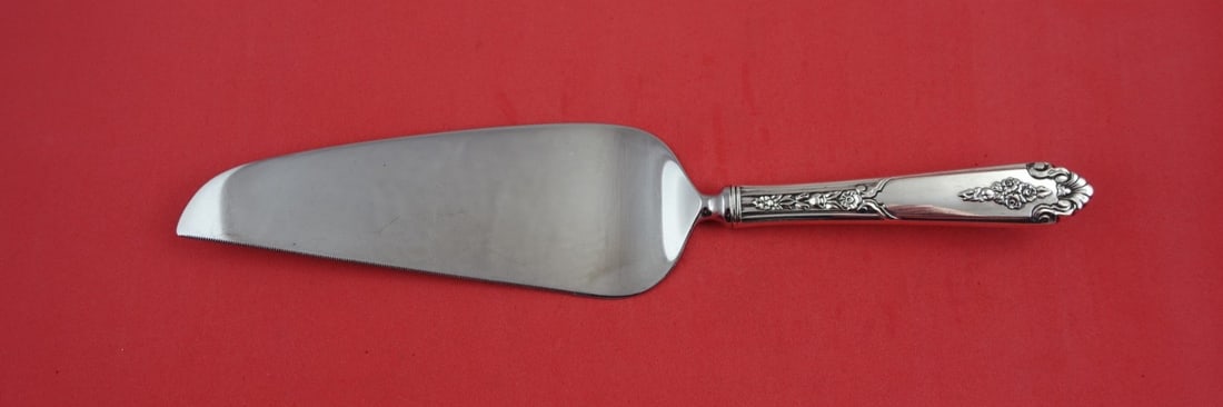 Royal Crest Wild Flower Sterling Silver Cake Server 9 3/4": Royal Crest Wild Flower Sterling Silver Cake Server 9 3/4" Serve your favorite desserts with elegance using this stunning cake server from the Wild Flower pattern by Royal Crest. This exquisite piece 