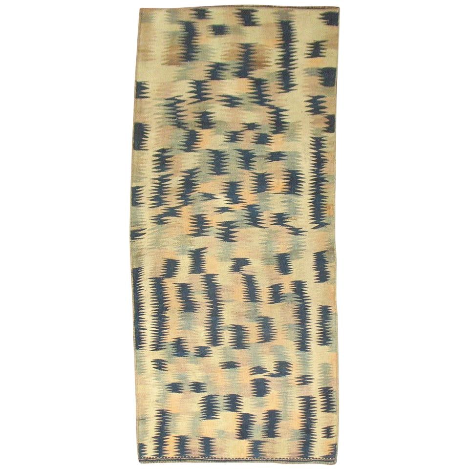 Midcentury Futurist Wool Turkish Kilim Rug 4 x 9'7": Midcentury Futurist Wool Turkish Kilim Rug 4 x 9'7" This hand-knotted Turkish Kilim from the mid-20th century features a primitive, abstract pattern in beige and blue tones. Crafted from wool in a Fut