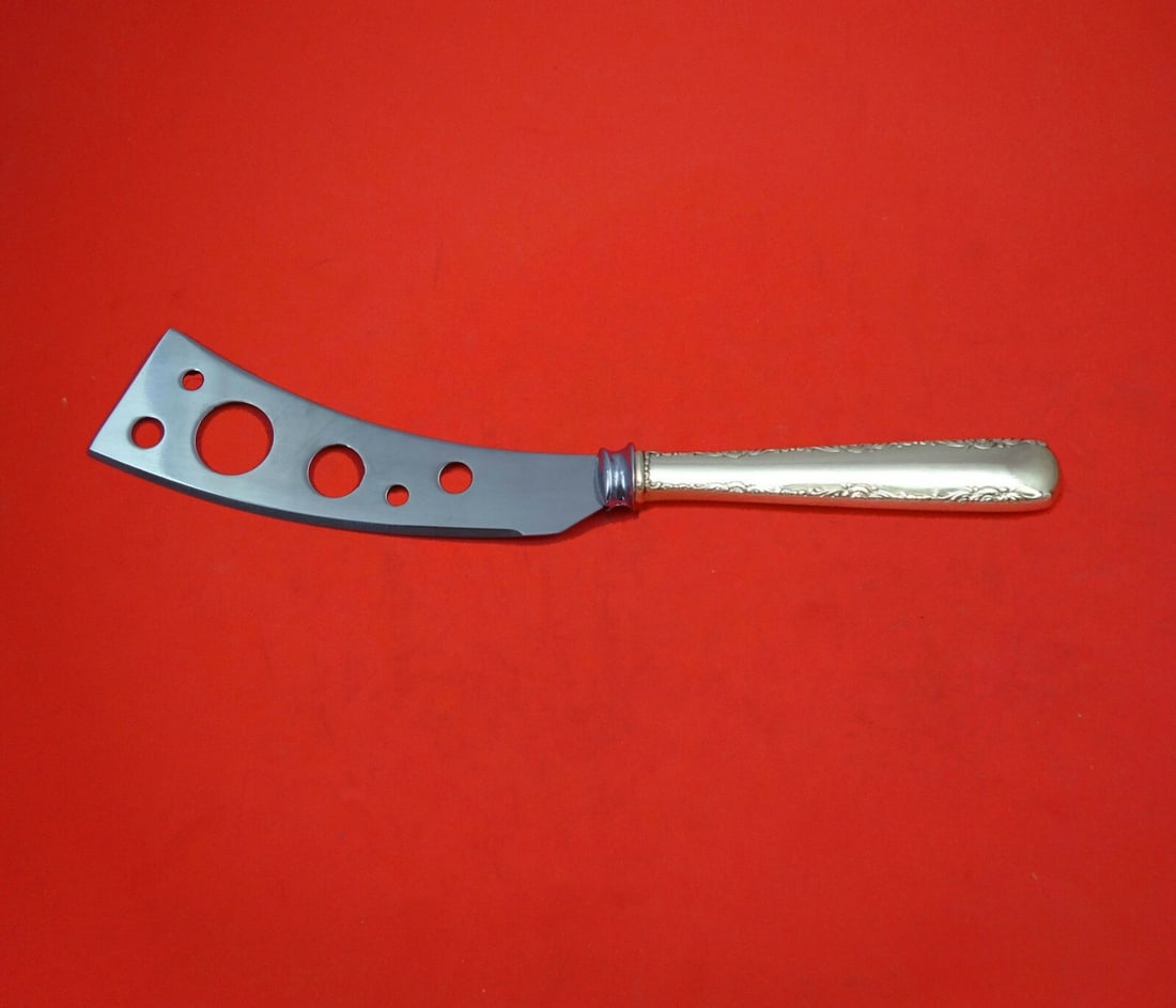 Gorham Camellia Sterling Silver Soft Cheese Knife 7" Pierced Blade: Gorham Camellia Sterling Silver Soft Cheese Knife 7" Pierced Blade Introducing the Camellia by Gorham Soft Cheese Knife, a stunning addition to your serving collection. Crafted from sterling silver, t