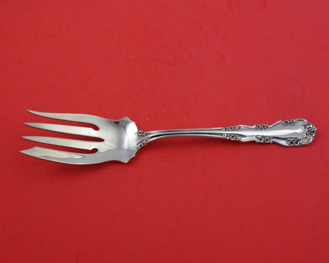 International Sterling Silver Wild Rose Old Serving Fork 8.5": International Sterling Silver Wild Rose Old Serving Fork 8.5" This exquisite cold meat fork from the Wild Rose Old pattern, also known as Rosalind Old, is crafted by International Sterling. Measuring 