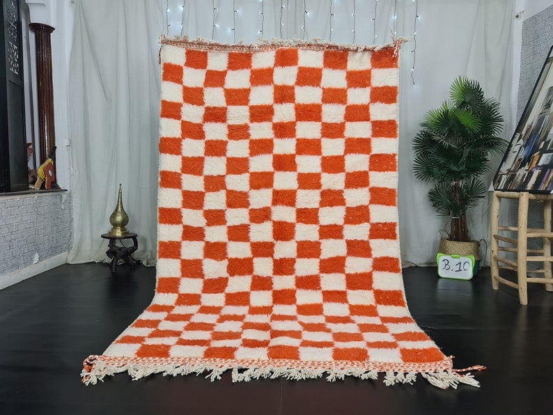 Handmade Moroccan Berber Wool Rug White Orange Chess Design 10 x 5 Feet: Handmade Moroccan Berber Wool Rug White Orange Chess Design 10 x 5 Feet Enhance your space with this stunning handmade Moroccan Berber wool rug featuring a striking white and orange chess design. This