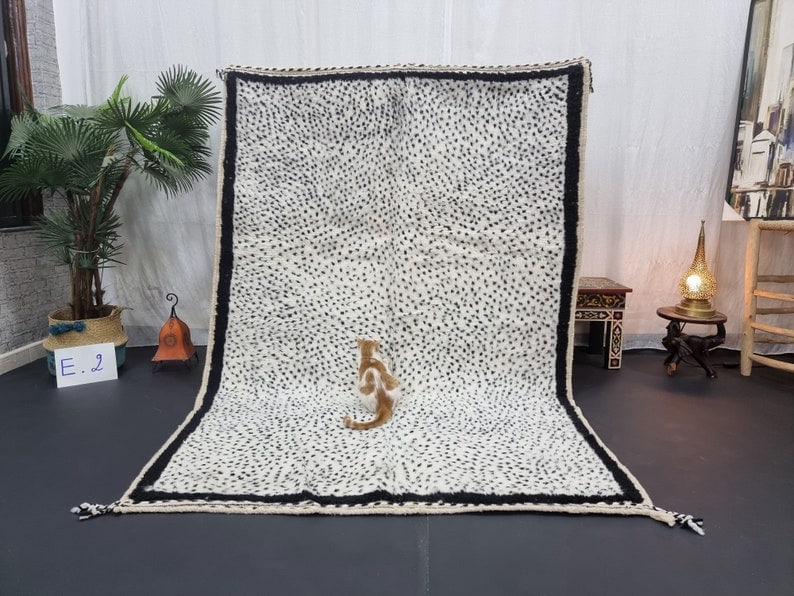 Authentic Handmade Moroccan Berber Wool Rug 8x5 Feet: Authentic Handmade Moroccan Berber Wool Rug 8x5 Feet Discover the beauty of this authentic handmade Moroccan Berber wool rug, intricately handwoven by local Berber women weavers in the scenic Middle A