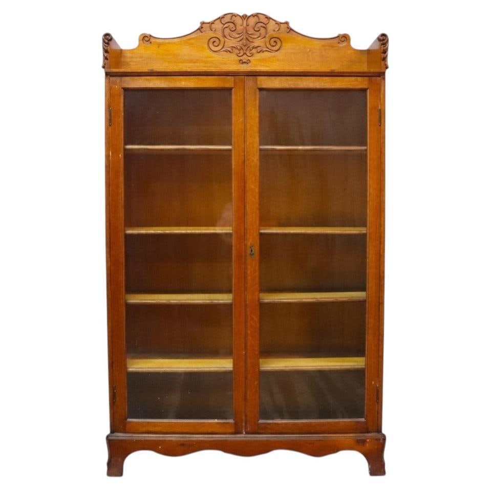 Antique carved oak glass door bookcase attributed to R.J. Horner (1 of 14)