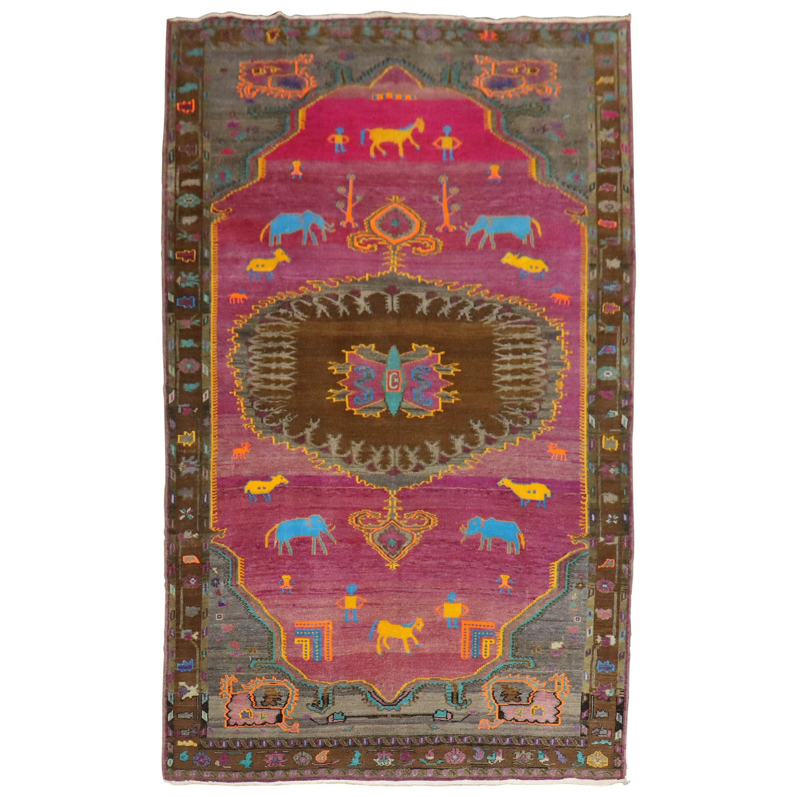 Mid 20th Century Turkish Wool Folk Art Rug with Whimsical Animal and Human Motifs: Mid 20th Century Turkish Wool Folk Art Rug with Whimsical Animal and Human Motifs This unique Turkish rug showcases a whimsical animal and human figurative motif on a vibrant fuchsia ground. Crafted f