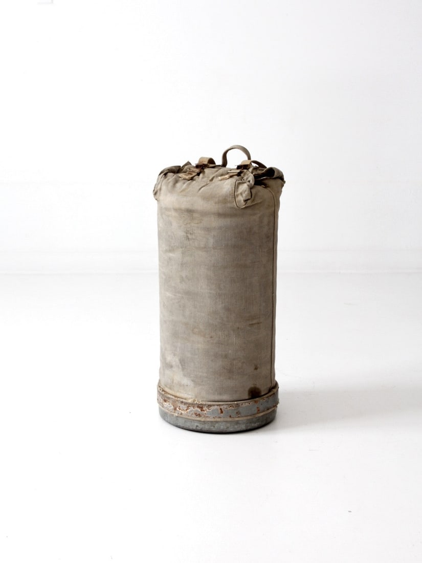 Rustic Vintage Army Camp Storage Bag Galvanized Metal Canvas: Rustic Vintage Army Camp Storage Bag Galvanized Metal Canvas Discover a unique piece of history with this Vintage Army Camp Bag. Designed as a functional storage container, it features a durable galva