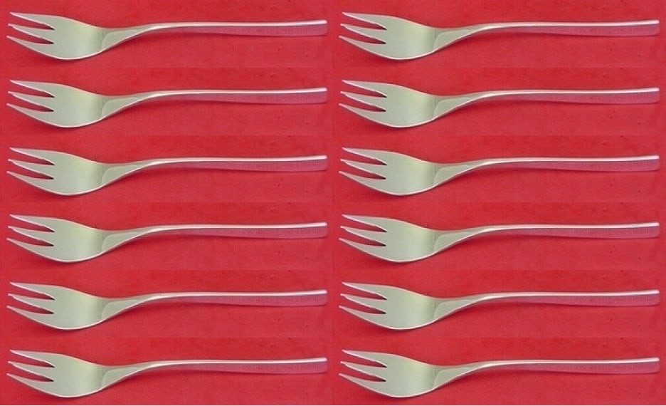 International Sterling Silver Vision Salad Forks Set of 12 3-Tine 6 3/8": International Sterling Silver Vision Salad Forks Set of 12 3-Tine 6 3/8" Enhance your dining experience with this exquisite set of 12 salad forks from the Vision pattern by International. Crafted from