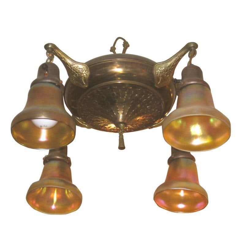 Mid Century Four Light Chandelier with Iridescent Glass Shades: Mid Century Four Light Chandelier with Iridescent Glass Shades This vintage four-light chandelier features golden iridescent blown glass shades, crafted in the Arts and Crafts style reminiscent of Tif