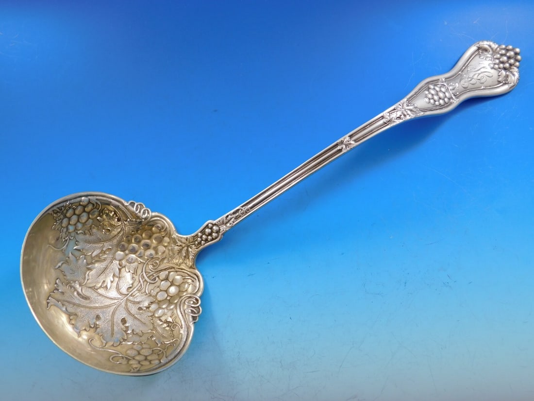 Dominick & Haff Grape Pattern Sterling Silver Gold Washed Soup Ladle 13": Dominick & Haff Grape Pattern Sterling Silver Gold Washed Soup Ladle 13" This exquisite soup ladle, crafted by Dominick & Haff, features a stunning grape pattern and is made of high-quality sterling s