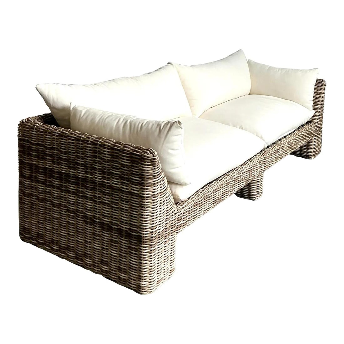 Woven Resin Rattan Outdoor Sofa with Block Feet and White Cushions by Holt: Woven Resin Rattan Outdoor Sofa with Block Feet and White Cushions by Holt This vintage outdoor sofa by Holt showcases a postmodern coastal aesthetic with its high-density woven resin construction, ex