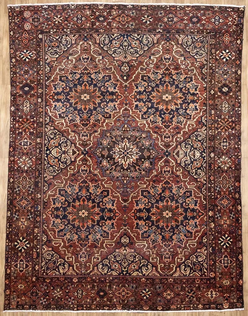Hand Knotted Wool Floral Area Rug 9'5-9'9 x 12'4: Hand Knotted Wool Floral Area Rug 9'5-9'9 x 12'4 This semi-antique handmade Oriental rug features a classic floral pattern in a blend of rusty brown, cream, light salmon, purple-navy, and brown tones.
