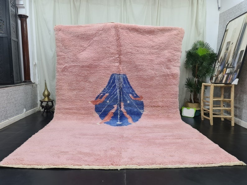 Authentic Pink Handmade Moroccan Berber Wool Rug 9.84 x 6.56 feet: Authentic Pink Handmade Moroccan Berber Wool Rug 9.84 x 6.56 feet Enhance your living space with this Authentic Pink Handmade Moroccan Berber Natural Wool Rug. Expertly handwoven in the Middle Atlas M