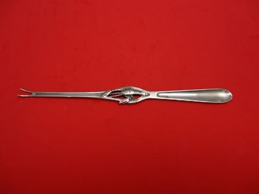 Sterling Silver Lobster Pick 7 3/4 Unknown German Design: Sterling Silver Lobster Pick 7 3/4 Unknown German Design This exquisite lobster pick is crafted from sterling silver, showcasing an elegant design with lobsters. Measuring 7 3/4 inches, it features a 