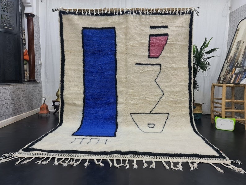 Artistic Handmade Moroccan Berber Wool Rug 9.84 x 6.56 Feet: Artistic Handmade Moroccan Berber Wool Rug 9.84 x 6.56 Feet Experience the elegance of this authentic handmade Moroccan Berber wool rug. Crafted with care, this stunning piece features a soft white ba