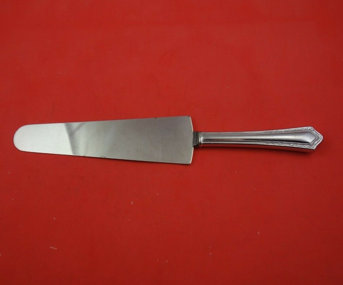 SSMC-Saart Arcadia Sterling Silver Cake Server 10 3/8 Inch: SSMC-Saart Arcadia Sterling Silver Cake Server 10 3/8 Inch This exquisite cake server from the Arcadia pattern by SSMC-Saart features a beautifully crafted sterling silver hollow handle paired with a 