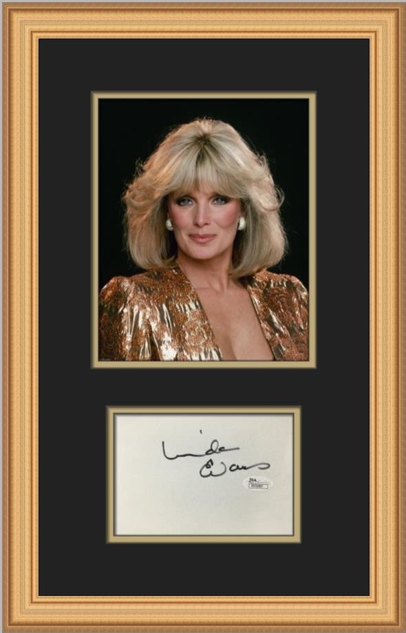 Framed Linda Evans Autographed Photo With Signed Card JSA Authenticated: Framed Linda Evans Autographed Photo With Signed Card JSA Authenticated This custom framed display features a signed 4" x 6" index card by Linda Evans, renowned for her role in Dynasty. The card is ac