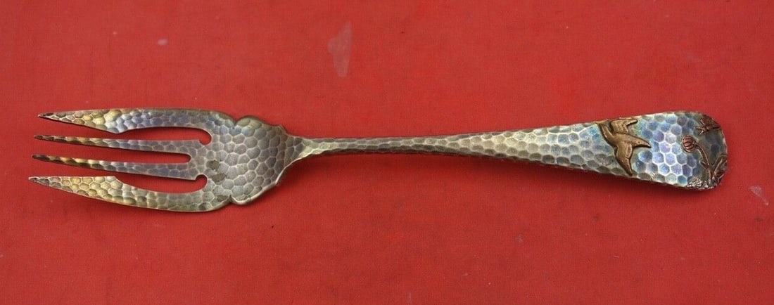 Gorham Applied Metals Sterling Silver Fish Fork with Copper Bird Flowers 6 7/8": Gorham Applied Metals Sterling Silver Fish Fork with Copper Bird Flowers 6 7/8" This exquisite fish fork, crafted by Gorham, is a stunning example of the Applied Metals pattern. Measuring 6 7/8" in le