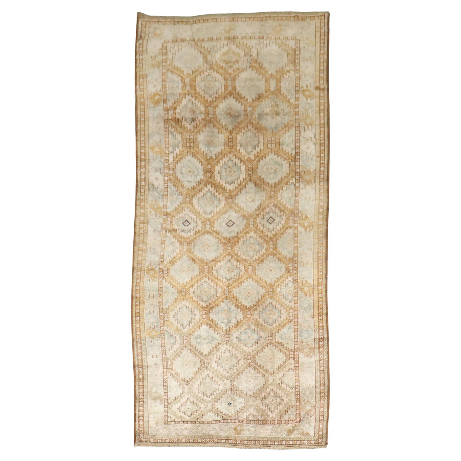 Early 20th Century Turkeman Beshir Hand-Knotted Wool Rug 62 x 137: Early 20th Century Turkeman Beshir Hand-Knotted Wool Rug 62 x 137 This exquisite early 20th century Turkeman Beshir gallery size rug showcases a stunning tribal design, meticulously hand-knotted from 
