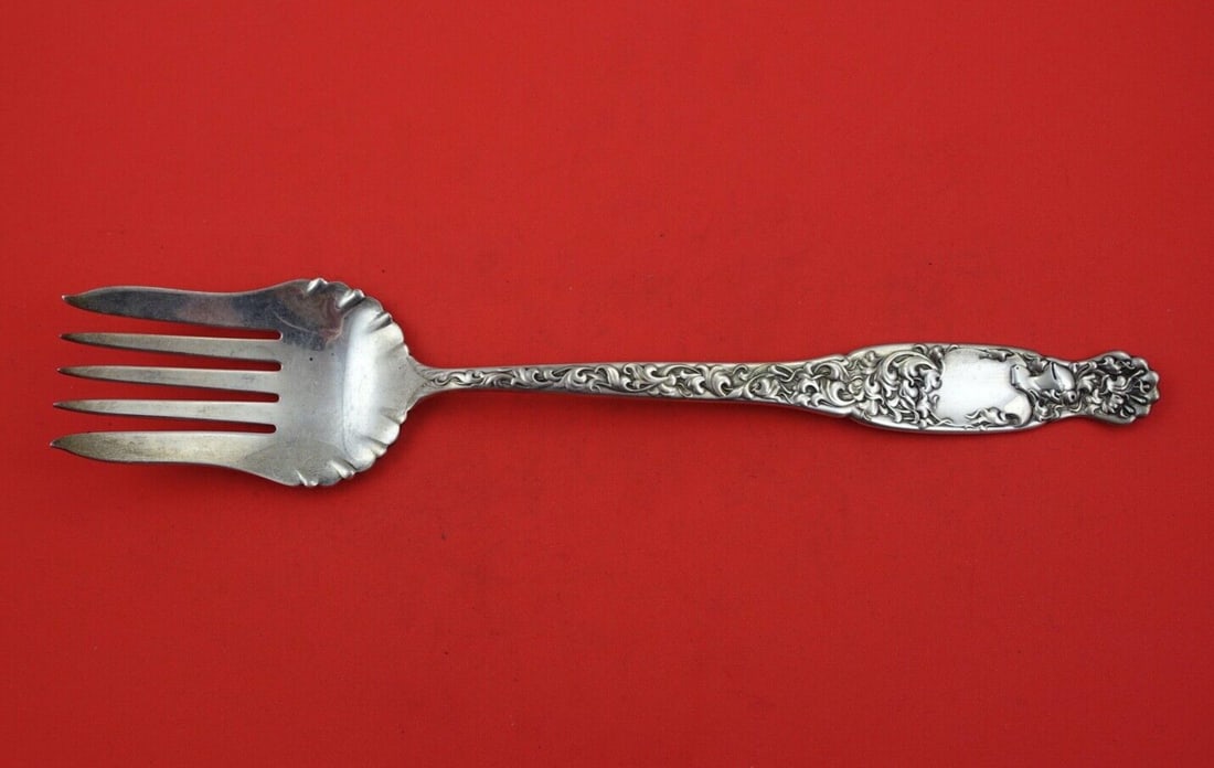Whiting Heraldic Sterling Silver 12 Salad Serving Fork Ruffled: Whiting Heraldic Sterling Silver 12 Salad Serving Fork Ruffled A sterling silver salad serving fork in the Heraldic pattern by Whiting. This large ruffled serving fork measures 12 inches and is not mo