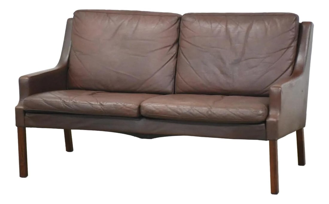1960s Rud Thygesen Danish Modern Rosewood Loveseat Sofa: 1960s Rud Thygesen Danish Modern Rosewood Loveseat Sofa This exquisite mid-century modern loveseat sofa, designed by Rud Thygesen in the 1960s, showcases a sophisticated chocolate brown leather uphols