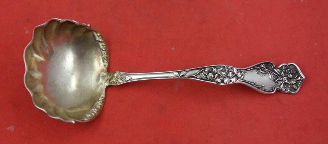 Blackinton Cherry Blossom sterling silver gravy ladle gold wash 7 in: Blackinton Cherry Blossom sterling silver gravy ladle gold wash 7 in Sterling silver gravy ladle in the Cherry Blossom pattern by Blackinton, featuring a gold wash finish and a 7-inch length. It is no