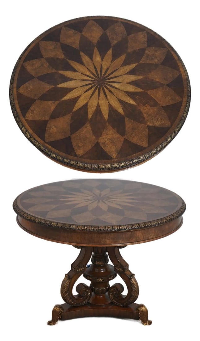 Maitland Smith Mahogany Spiro Pedestal Table 40w x 40d x 30.5h: Maitland Smith Mahogany Spiro Pedestal Table 40w x 40d x 30.5h This Maitland Smith round Spiro center table features a rich mahogany construction with a striking marquetry starburst parquetry inlay. T