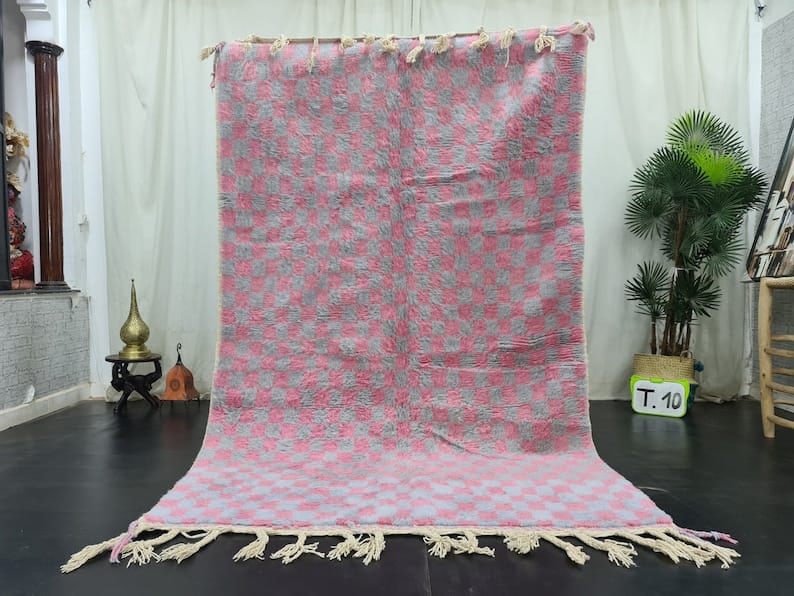 Authentic Soft Pink Moroccan Berber Wool Area Rug 8 x 5 Feet: Authentic Soft Pink Moroccan Berber Wool Area Rug 8 x 5 Feet Enhance your living space with this authentic Soft Pink Handmade Moroccan Berber Wool Area Rug. Handwoven in the picturesque Atlas Mountain